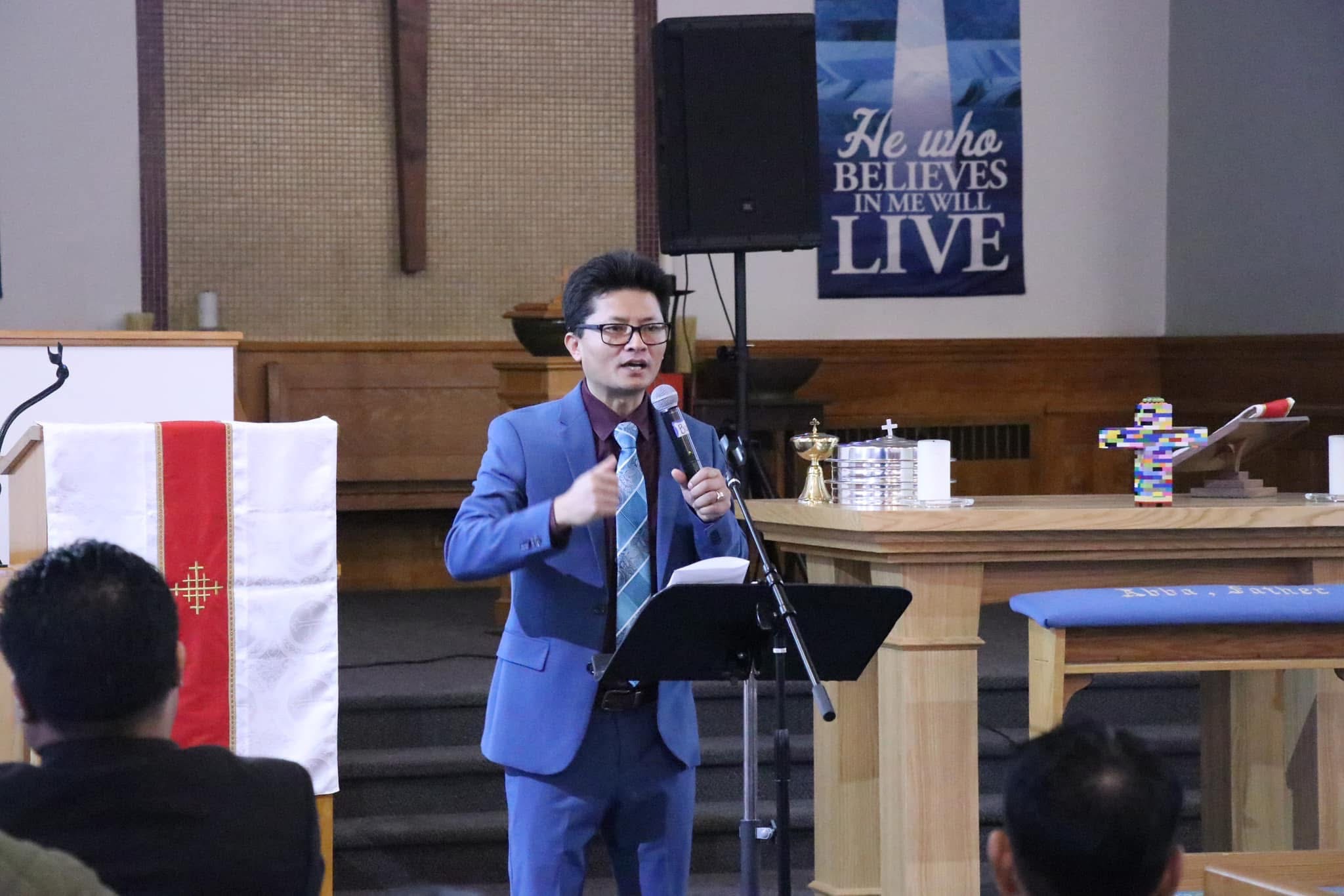 Rev. Dr. Thomas BK Lian speaking in the church sanctuary